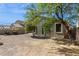 Back of house featuring a gravel backyard, small patio and mature tree at 3013 W Via De Pedro Miguel --, Phoenix, AZ 85086