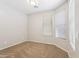 Carpeted bedroom featuring bright neutral walls and a large window at 3013 W Via De Pedro Miguel --, Phoenix, AZ 85086