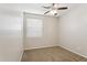 Bedroom features neutral carpet, a ceiling fan, and a window at 3013 W Via De Pedro Miguel --, Phoenix, AZ 85086