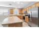 Bright eat-in kitchen features an island, tiled flooring, and stainless steel appliances at 3013 W Via De Pedro Miguel --, Phoenix, AZ 85086