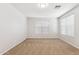 Spacious living room with carpet flooring and neutral paint, filled with natural light at 3013 W Via De Pedro Miguel --, Phoenix, AZ 85086