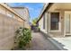 Side yard space with gravel, block fence, and an AC unit at 3013 W Via De Pedro Miguel --, Phoenix, AZ 85086