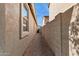 Narrow side yard with gravel and block fencing at 3013 W Via De Pedro Miguel --, Phoenix, AZ 85086