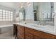 Serene bathroom with double sinks, ample counter space, and a soaking tub with mosaic backsplash at 3054 E Norwood St, Mesa, AZ 85213