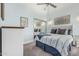Comfortable bedroom with a ceiling fan, blue walls, a mirror, and an art piece at 3054 E Norwood St, Mesa, AZ 85213
