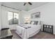 Cozy bedroom features carpet, large windows, and simple decor creating a peaceful atmosphere at 3054 E Norwood St, Mesa, AZ 85213