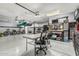Organized garage with storage racks and shelving, work area, and overhead racks for kayaks at 3054 E Norwood St, Mesa, AZ 85213