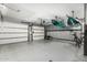 Spacious garage with room for vehicle storage, and overhead racks for kayaks at 3054 E Norwood St, Mesa, AZ 85213