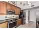 Well-equipped kitchen featuring granite countertops, stainless steel appliances, and ample cabinet space at 3054 E Norwood St, Mesa, AZ 85213