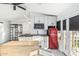 Bright, modern kitchen with white cabinets, butcher block countertops, and retro appliances at 3054 E Norwood St, Mesa, AZ 85213