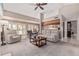 Comfortable living room with neutral tones, a ceiling fan, and ample seating at 3054 E Norwood St, Mesa, AZ 85213
