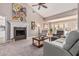 Spacious living room boasts a fireplace, neutral palette, and French doors to backyard at 3054 E Norwood St, Mesa, AZ 85213