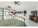 Open floor plan showcasing a sleeping area, modern kitchen, and access to the outdoors at 3054 E Norwood St, Mesa, AZ 85213