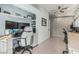 Bright home office featuring lots of natural light, built-in desk, shelving, and tile flooring at 3054 E Norwood St, Mesa, AZ 85213