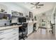 Bright home office with built-in desk, shelving, and lots of natural light overlooking the backyard at 3054 E Norwood St, Mesa, AZ 85213
