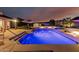 Sparkling pool with LED lighting and a seating area, perfect for evening relaxation at 3054 E Norwood St, Mesa, AZ 85213