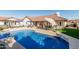 Stunning backyard with a sparkling pool, lounge area, and outdoor dining space at 3054 E Norwood St, Mesa, AZ 85213
