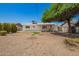 Backyard featuring a low maintenance desert landscape and a covered patio at 3118 W Aster Dr, Phoenix, AZ 85029