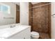 Bathroom featuring a vanity and tiled shower with neutral color palette at 3118 W Aster Dr, Phoenix, AZ 85029