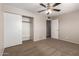 Spacious bedroom features a ceiling fan and closet for ample storage at 3118 W Aster Dr, Phoenix, AZ 85029