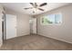 Bright bedroom with a large window letting in natural light at 3118 W Aster Dr, Phoenix, AZ 85029