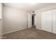 Neutral toned bedroom with closet and connecting bath access at 3118 W Aster Dr, Phoenix, AZ 85029