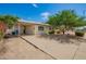 Attractive one-story home showcasing a covered carport, desert landscaping, and a lovely curbside appeal at 3118 W Aster Dr, Phoenix, AZ 85029