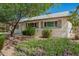 Well-kept single-level home with white paint, desert landscaping, and shutters on windows at 3118 W Aster Dr, Phoenix, AZ 85029
