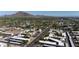 Expansive aerial view of a desert community with lush landscaping and the majestic Camelback Mountain in the background at 3314 N 68Th St # 129, Scottsdale, AZ 85251