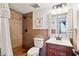 Bathroom with tiled shower and vanity with a modern sink and dark wood cabinets at 3314 N 68Th St # 129, Scottsdale, AZ 85251