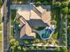 A bird's eye view shows the layout, pool, outdoor kitchen, and landscaped areas of this well-maintained property at 3354 E Jaeger Cir, Mesa, AZ 85213