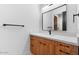 Bathroom showcasing wood cabinets, granite countertops, modern fixtures, and ample storage space at 3354 E Jaeger Cir, Mesa, AZ 85213