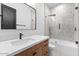 Modern bathroom with stylish tile, white countertops, wood cabinets and a glass enclosed shower at 3354 E Jaeger Cir, Mesa, AZ 85213