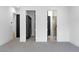 Modern bedroom featuring soft carpet and access to a closet and stylish bathroom at 3354 E Jaeger Cir, Mesa, AZ 85213