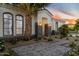 Elegant home exterior featuring desert landscaping and a stylish walkway to the front door at 3354 E Jaeger Cir, Mesa, AZ 85213