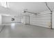 Spacious three-car garage with epoxy floors, providing ample parking and storage space at 3354 E Jaeger Cir, Mesa, AZ 85213
