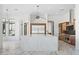 Spacious kitchen with a large marble island and stainless steel appliances at 3354 E Jaeger Cir, Mesa, AZ 85213
