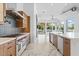 Bright kitchen featuring a large island, stainless steel appliances, and tile floors at 3354 E Jaeger Cir, Mesa, AZ 85213