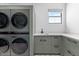 Functional laundry area with stacked washer/dryer, plenty of counter space, and storage for convenience at 3354 E Jaeger Cir, Mesa, AZ 85213