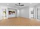 Bright living room featuring beautiful herringbone floors, recessed lighting, and large openings at 3354 E Jaeger Cir, Mesa, AZ 85213