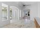 Large living area with tile flooring, light fixture, and many windows at 3354 E Jaeger Cir, Mesa, AZ 85213