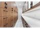 Walk-in pantry featuring custom cabinets, marble countertops, and ample storage space at 3354 E Jaeger Cir, Mesa, AZ 85213