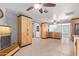 Spacious kitchen area featuring wood cabinetry, an adjacent eating area, and ample storage at 3539 W Davidson Ln, Phoenix, AZ 85051