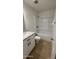 Well-lit bathroom featuring a shower-tub combo and granite vanity at 4217 W Medlock Dr, Phoenix, AZ 85019