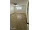 Bedroom featuring tile flooring, white walls, and a window at 4217 W Medlock Dr, Phoenix, AZ 85019