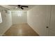 Bright bedroom featuring a ceiling fan and tile flooring at 4217 W Medlock Dr, Phoenix, AZ 85019