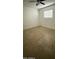Bedroom featuring tile flooring, white walls, and a ceiling fan at 4217 W Medlock Dr, Phoenix, AZ 85019
