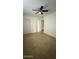 Bedroom featuring tile flooring, white walls, and a ceiling fan at 4217 W Medlock Dr, Phoenix, AZ 85019