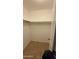 Walk-in closet with built-in shelving and tile flooring at 4217 W Medlock Dr, Phoenix, AZ 85019