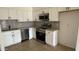 Bright kitchen features white cabinets, modern stainless steel appliances, and a stylish backsplash at 4217 W Medlock Dr, Phoenix, AZ 85019